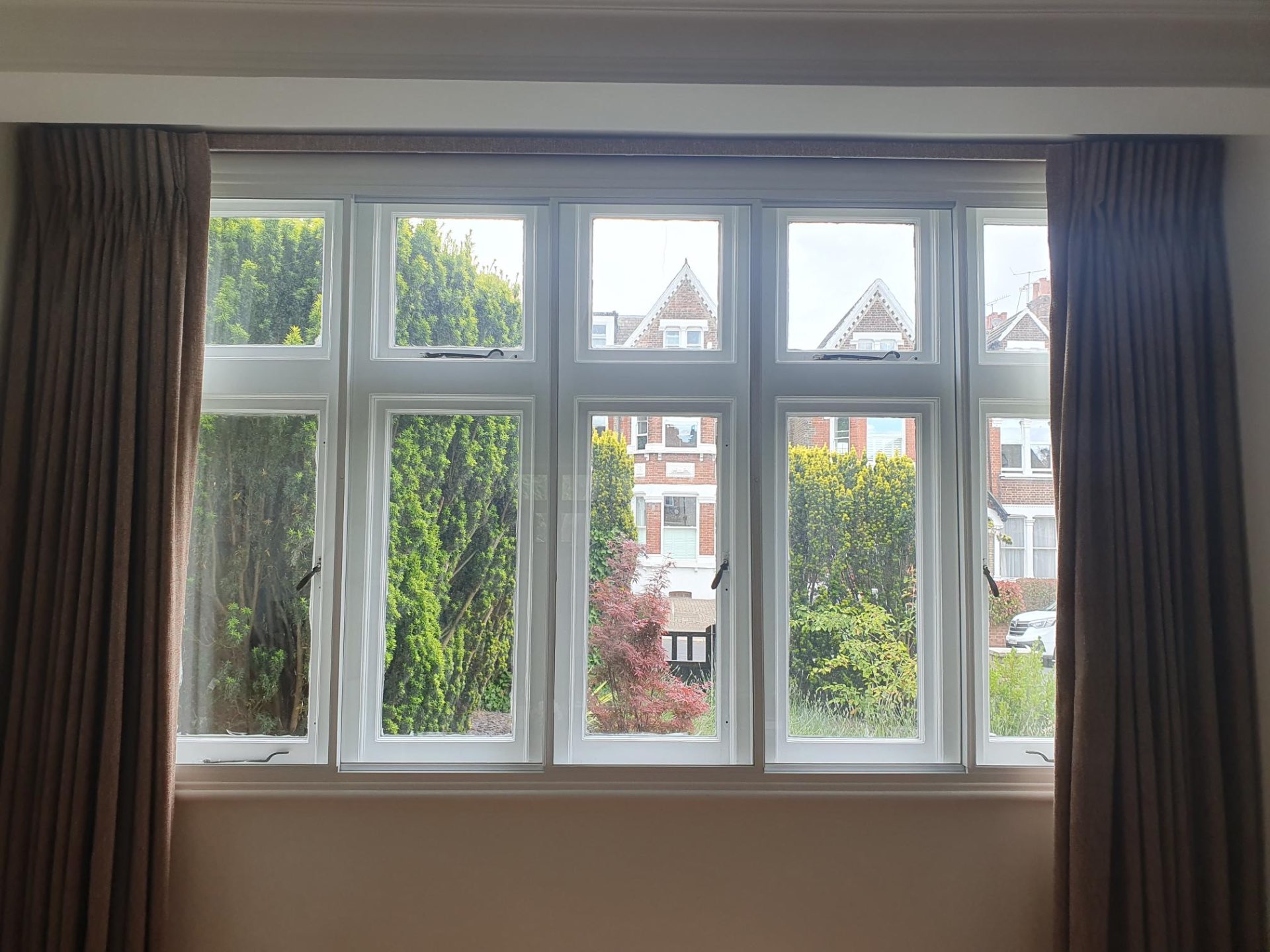 Wide horizontal sliding secondary glazing installation