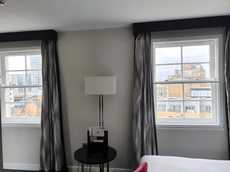 Urban property with acoustic secondary glazing for city noise reduction