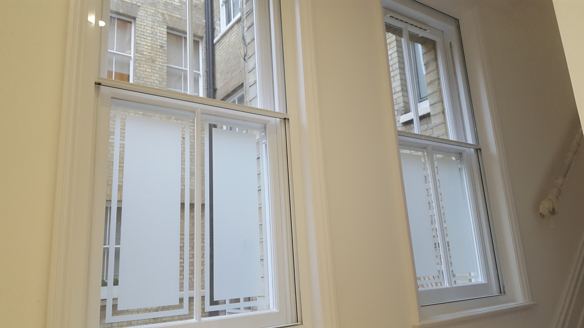 Secondary glazing installation showing effective condensation control with clear window panes
